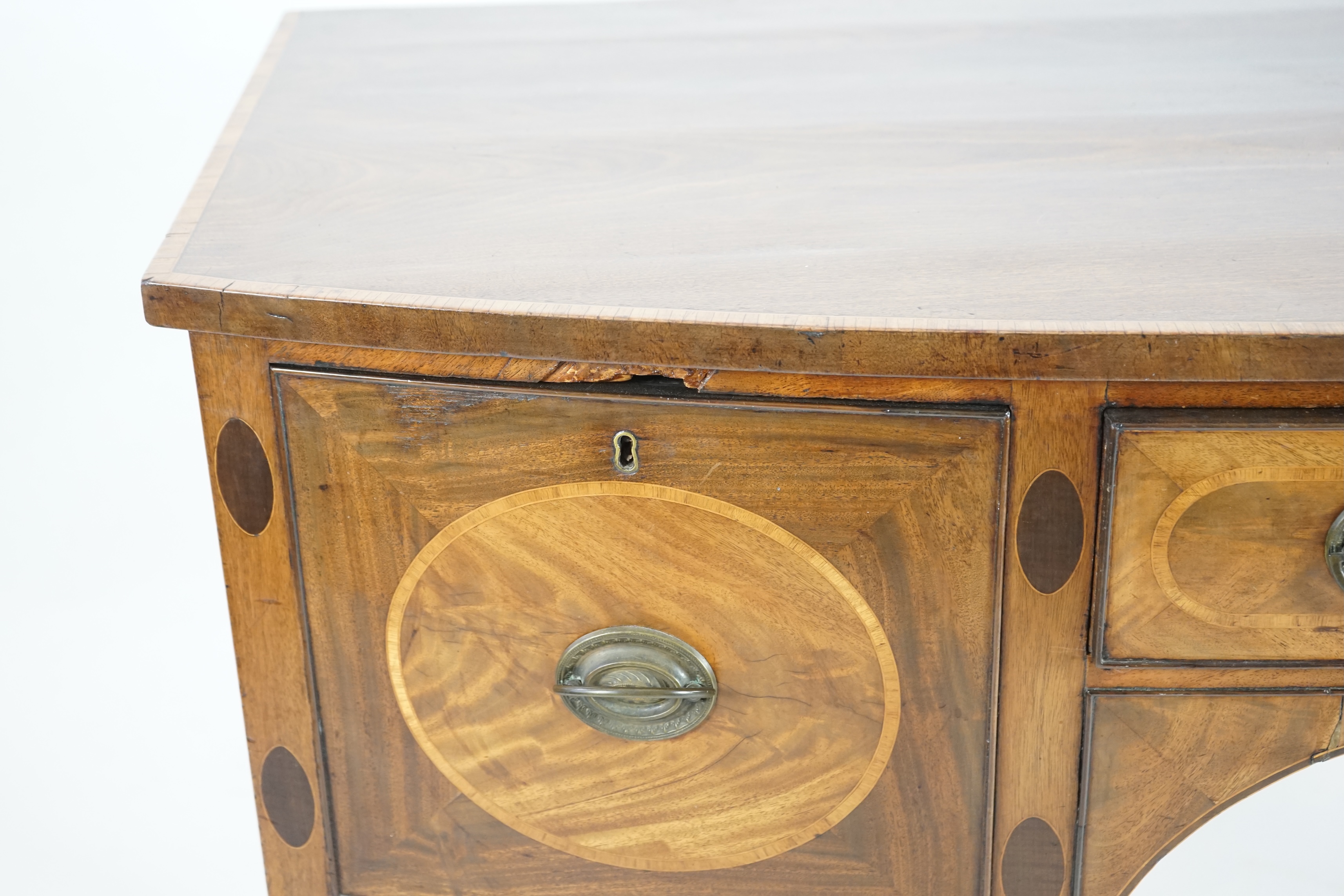 A George III rosewood banded mahogany bowfront sideboard